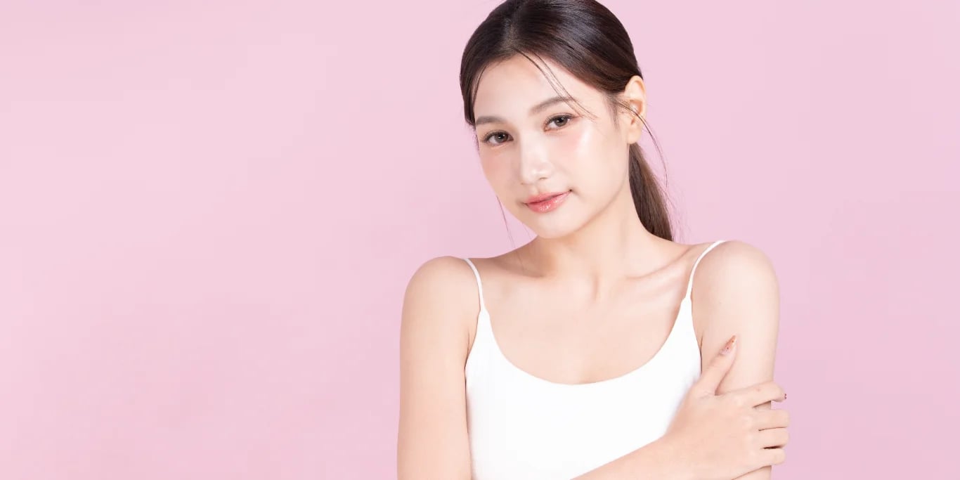 Closeup young asian beautiful woman hand touching arm Closeup young asian beautiful woman hand touching arm